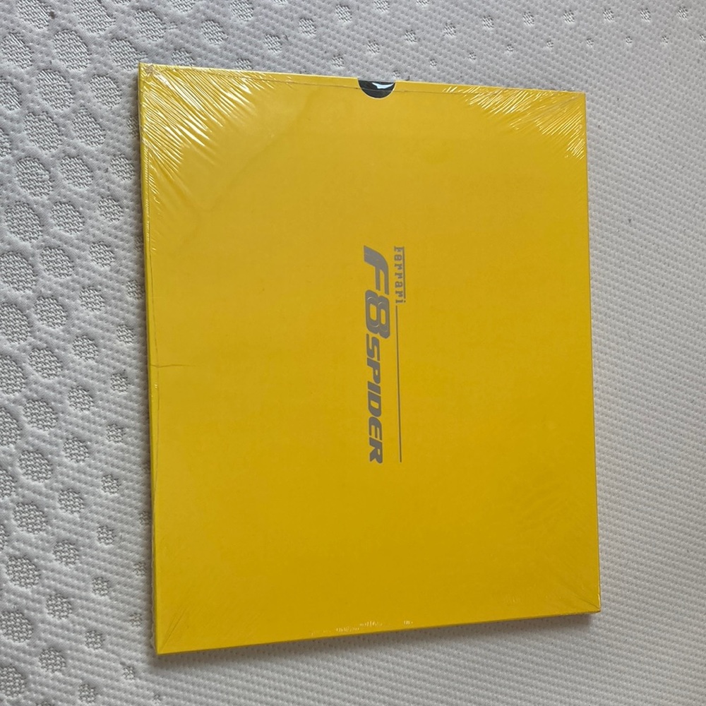 this is a Ferrari collection book, still wrapped gear condition, never been open